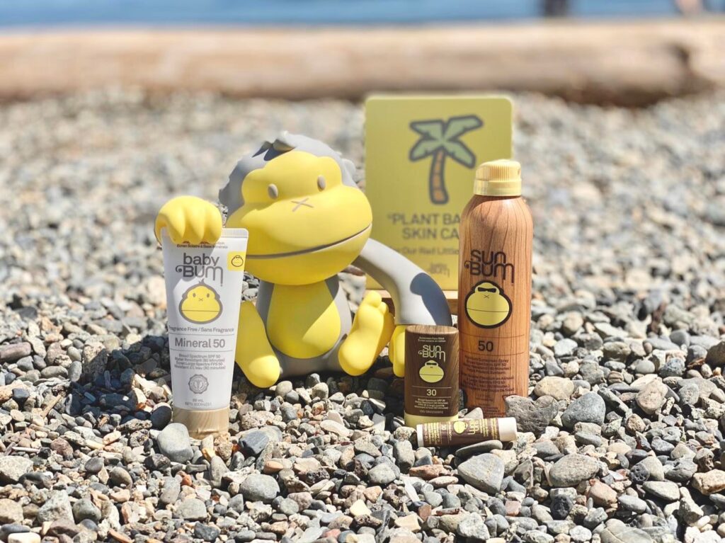 A set of different SunBums at a rocky beach. Sun bum is one of the best non toxic sunscreen for kids 