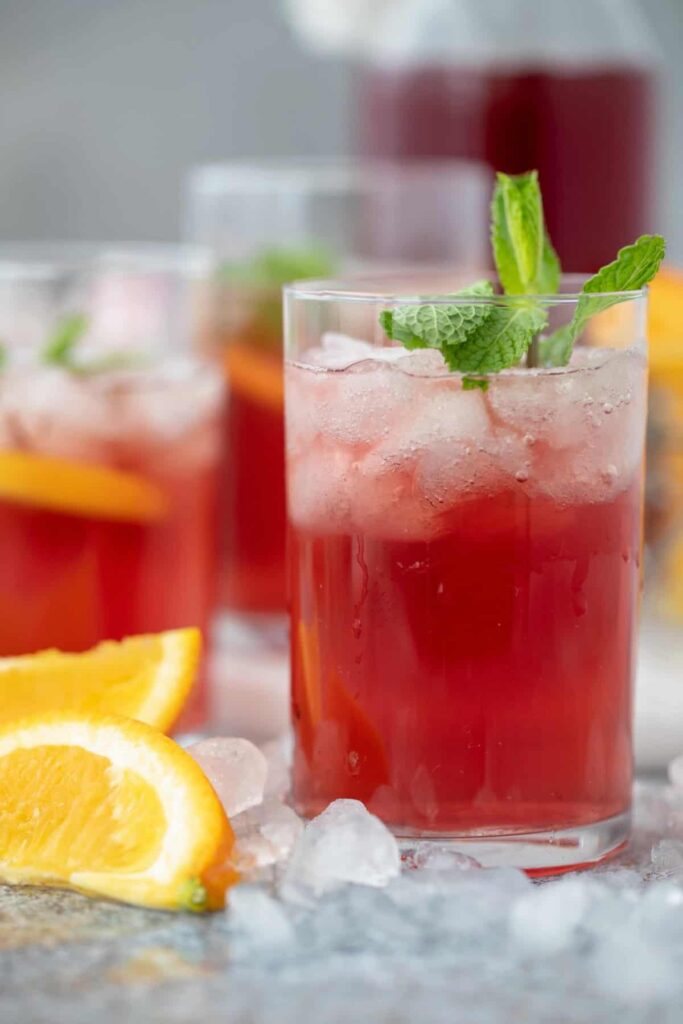 image a fresh drink that include juice recipes with cranberries. Its cranberry with orange and apple cider vinegar