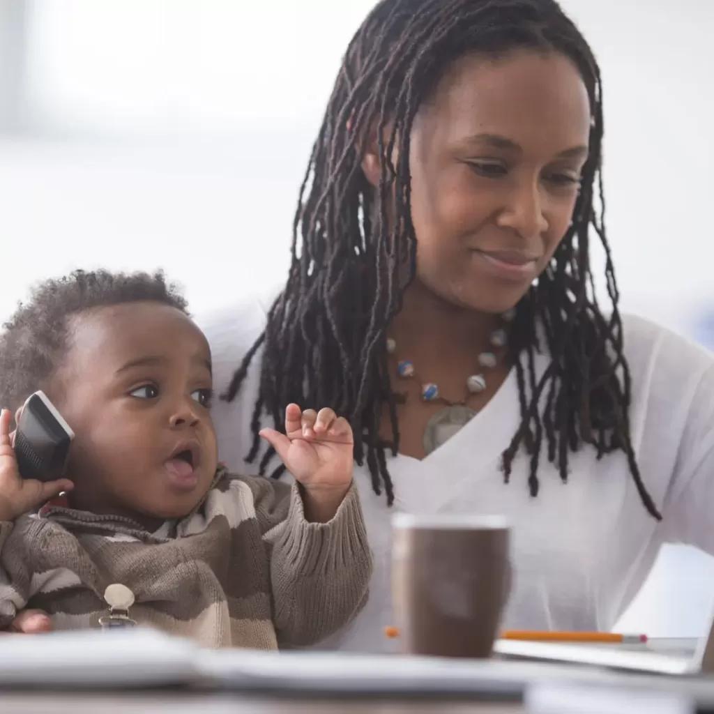 a baby prentending to have a phone while his working 